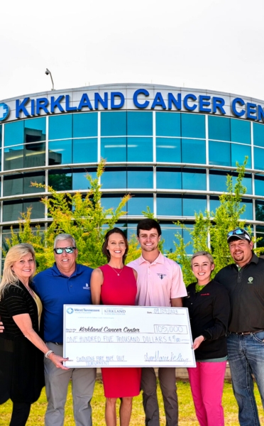 Ann Marie Kelly in front of the Kirkland Cancer Center
